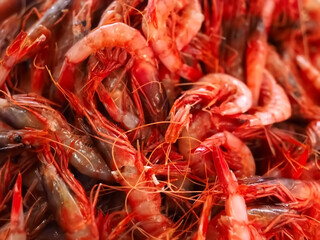 Raw fresh shrimps in a pile at a seafood market