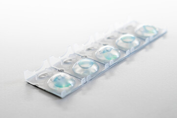 Package of contact lenses for the eyes on a white background