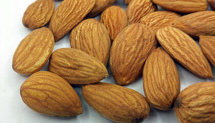 Californian almond nuts on white background. Unshelled almonds best healthy dried fruit photography