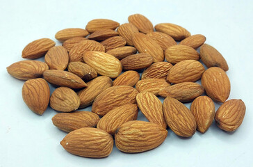 Californian almond nuts on white background. Unshelled almonds best healthy dried fruit photography