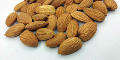Californian almond nuts on white background. Unshelled almonds best healthy dried fruit photography