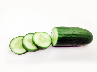Cucumber with slices. Ripe cucumber on white background.