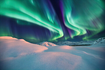 Northern Lights over lake. Aurora borealis with starry in the night sky. Fantastic Winter Epic...