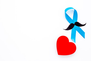 Awareness blue ribbon with red heart. Symbol of prostate cancer