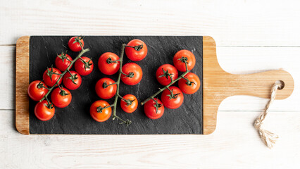 Fresh cherry tomatoes on slate plate