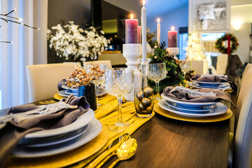 Christmas Eve table decorations, Christmas mood, Christmas tree on the dining table. Defocused