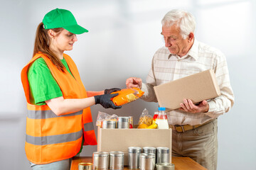 Help Collection Center, free food distribution. Volunteers wearing uniform green caps, t-shirts,...