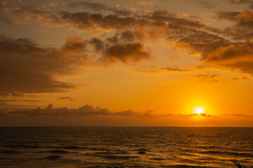 Fototapeta na wymiar Beautiful and colorful sunrise on the Brazilian beach