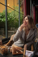 Fototapeta premium Smiling while eating her food