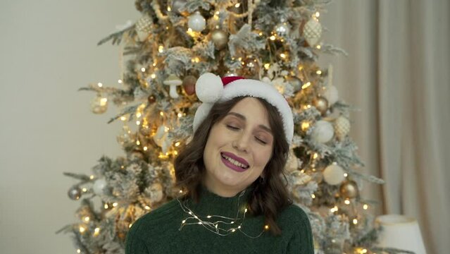 woman calls her friends via video conference call wishing Merry Christmas