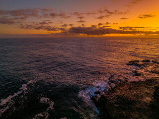 Dawn by the ocean with rocks