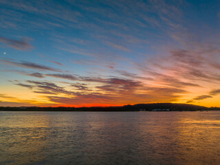 High cloud sunrise at the waterfront