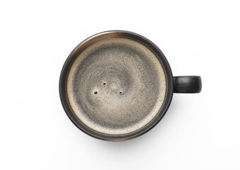 Large black coffee in porcelain cup on white background. Top view.
