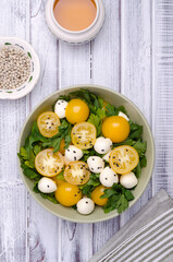 Yellow tomatoes, mozzarella and parsley