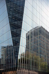 Fototapeta na wymiar London, UK - 30th April 2022: Detail of a modern, tall glass building