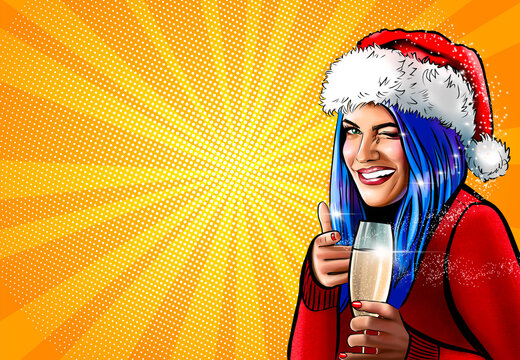 Pop art happy smiling girl with blue hair holding glass of champagne and pointing at you over yellow rays background. Portrait of young beautiful Christmas woman wearing Santa's hat