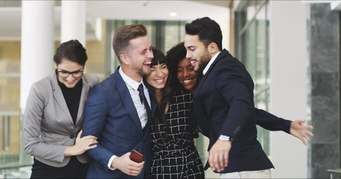 Business people, success and team hug in celebration of goal, good news and successful strategy in office building. Happy, team and win, smile and achievement by group celebrating startup proposal