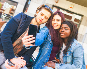 Three friends take a selfie.