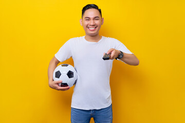 fans to support football sports team.  smiling young Asian man 20s wearing white t-shirt holding a...
