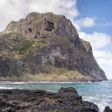 huge steep cliffs at island northern shore on Atlantic ocean, west of Porto de Cruz, Madeira