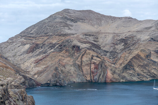 volcanic layers on barren slopes of cove on Atlantic ocean, Baia d Abra, Madeira
