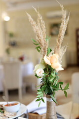 A beautiful wedding bouquet of white roses. Preparation for the wedding.