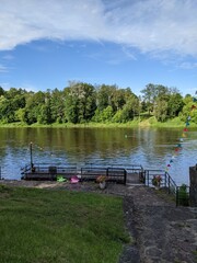 pier by the river overlooking the green shore