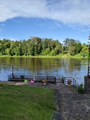 pier by the river overlooking the green shore