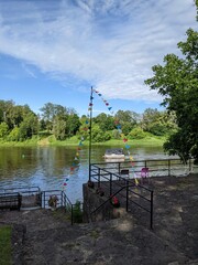 pier by the river overlooking the green shore