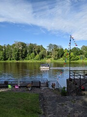 pier by the river overlooking the green shore