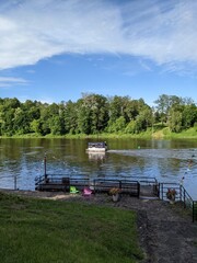 pier by the river overlooking the green shore