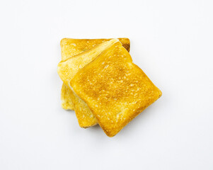 Toasted slices of bread on a white background. Cooked in a toaster.
