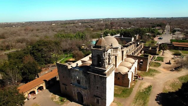 Aerial Panning Shot Of Tourists Exploring Mission San Jose Church In National Park On Sunny Day - San Antonio, Texas