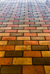 Part of the pavement made of colored paving stones.