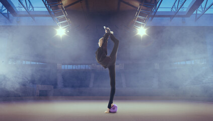 Fototapeta na wymiar Rhythmic gymnast in professional arena