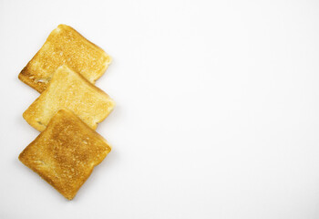 Toasted slices of bread on a white background. Cooked in a toaster.