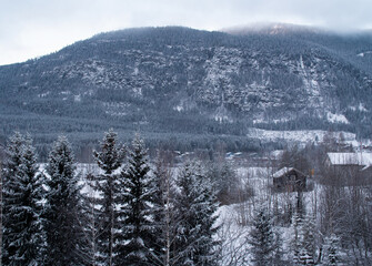 Mountain landscape behind a frozen river in Norway