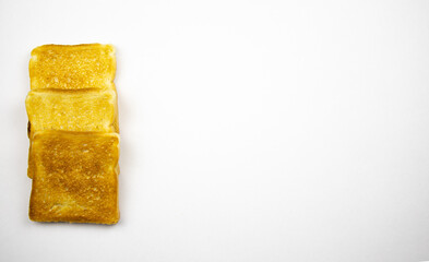 Toasted slices of bread on a white background. Cooked in a toaster.