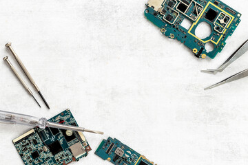 Electronics checkup - circuit board with microchips and tools, top view