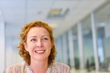 Fototapeta premium Smiling young woman as a successful business woman