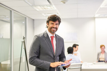  Manager or consultant using tablet computer in the office