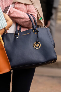 Milan, Italy - September, 22: woman influencer wearing large sutton satchel from Michael Kors. Fashion blogger outfit details, street style
