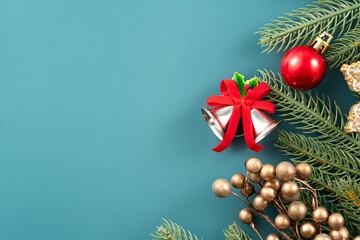 Christmas background design concept with beautiful decors, tree branch and golden bell.