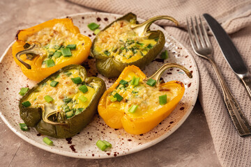Keto diet dish - pepper stuffed with eggs, cheese and bacon , baked in oven.