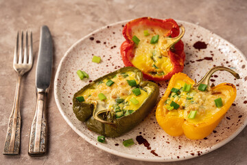 Keto diet dish - pepper stuffed with eggs, cheese and bacon , baked in oven.