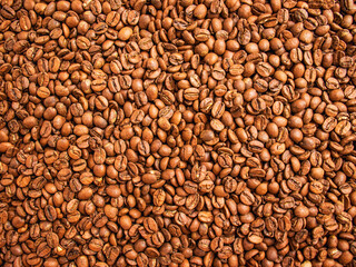 coffee background,roasted coffee beans, brown background, selective focus