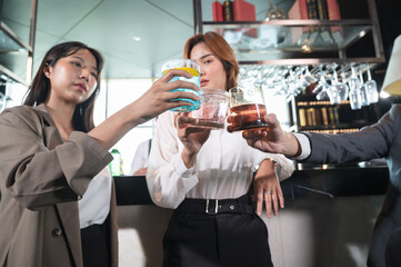 Business team cheers with front bar at hotel restaurant