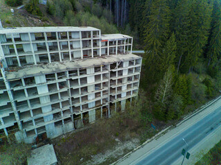 Abandoned hotel stands in forest on slope of Rhodope Mountains