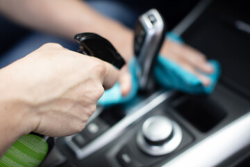 man washing car salon with rag
