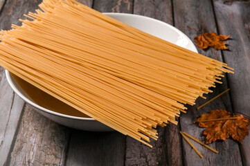 Thin long vermicelli on the table in the kitchen 
 - obrazy, fototapety, plakaty